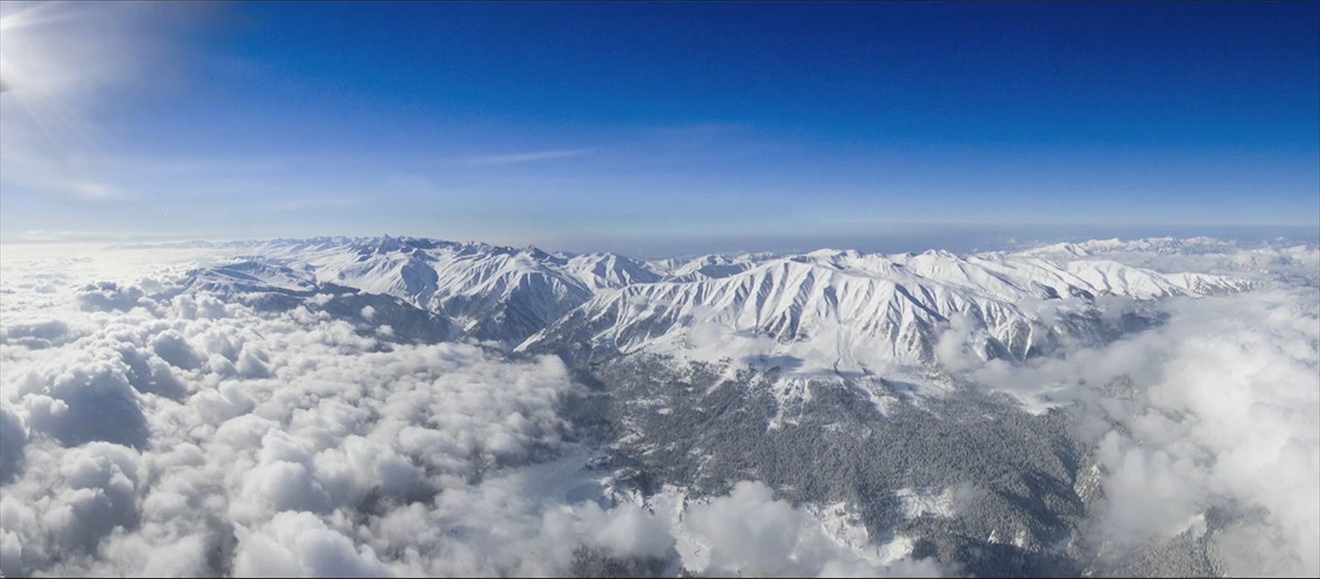 Snow peaks above the clouds on the Pir Panjal